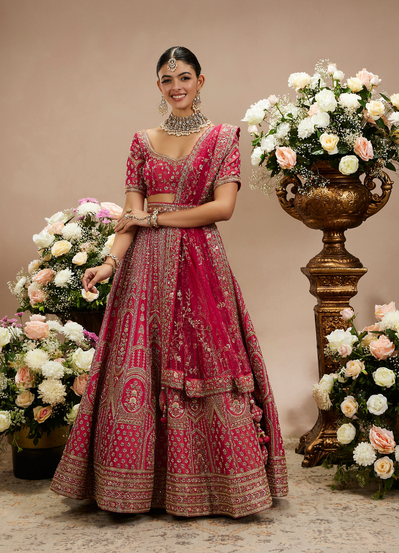 Twamev Women Rani Pink Zari Embroidered Lehenga with Floral And Buta Motifs And Pillow Trim Latkans