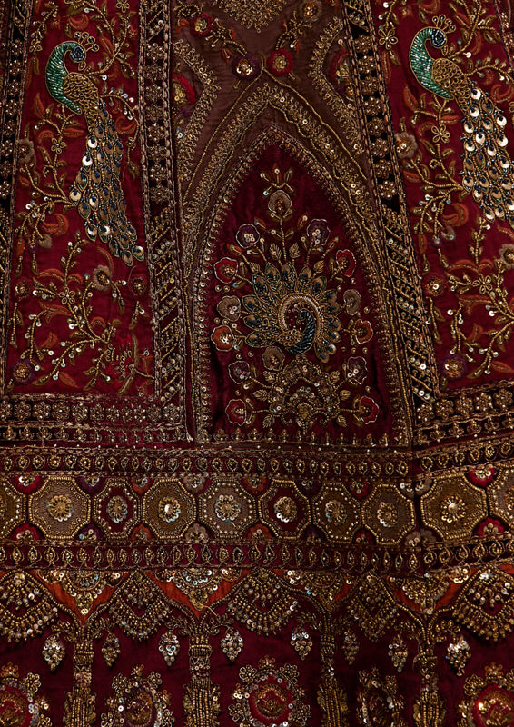 Twamev Women Maroon Red Jhallar Patterned Lehenga with Peacock And Pillow Trim Latkans
