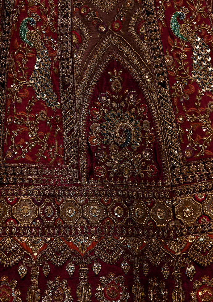 Twamev Women Maroon Red Jhallar Patterned Lehenga with Peacock And Pillow Trim Latkans