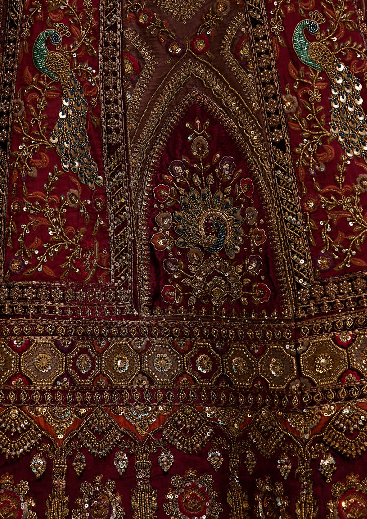 Twamev Women Maroon Red Jhallar Patterned Lehenga with Peacock And Pillow Trim Latkans