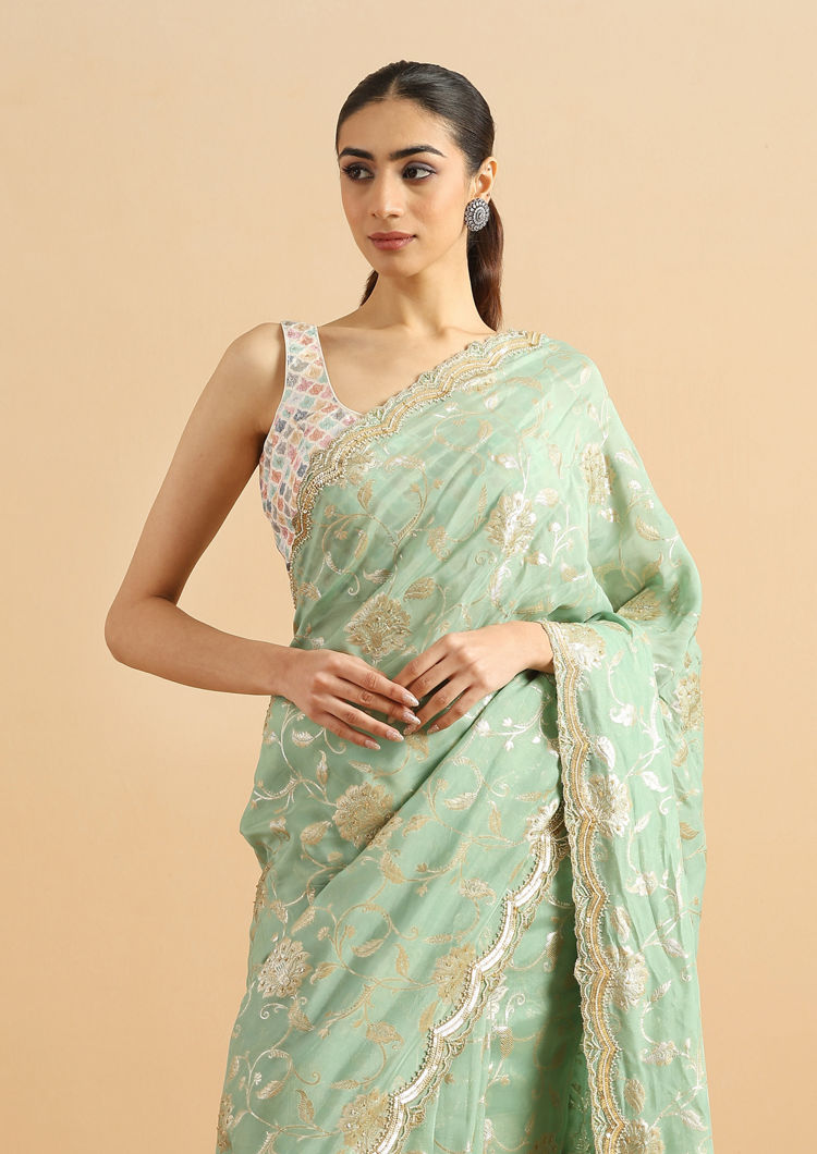 alt message - Twamev Women Whispering Pista Green Organza Saree image number 1