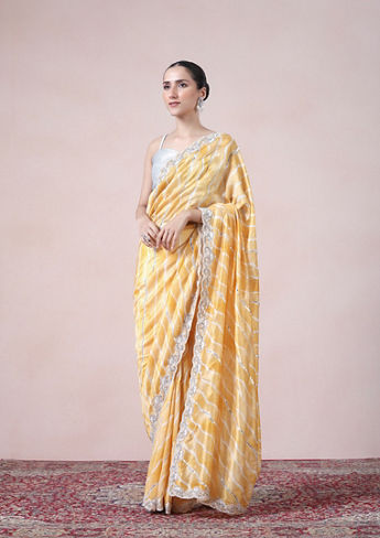 alt message - Twamev Women Modern Yellow Leheriya Inspired Saree image number 3