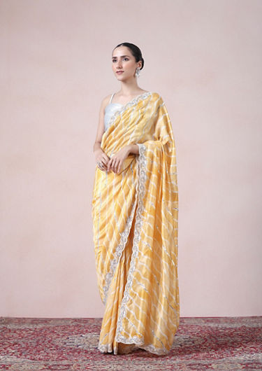 alt message - Twamev Women Modern Yellow Leheriya Inspired Saree image number 3