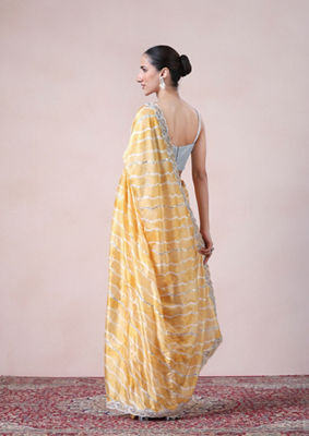 alt message - Twamev Women Modern Yellow Leheriya Inspired Saree image number 2