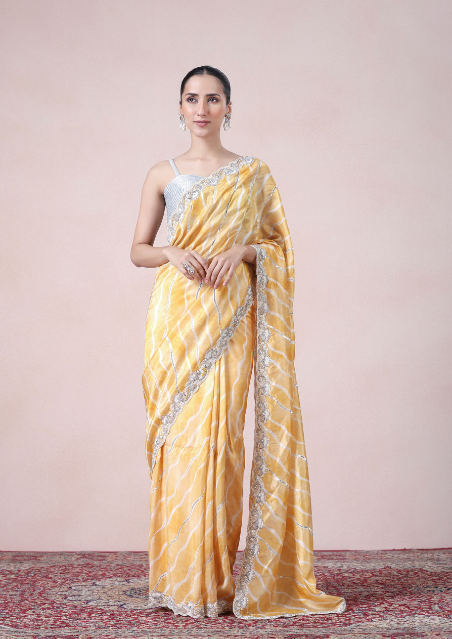 alt message - Twamev Women Modern Yellow Leheriya Inspired Saree image number 0