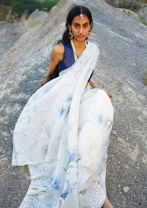 Twamev Women Cloud Cream Hand Embroidered Sequined Saree with Navy Blue Blouse