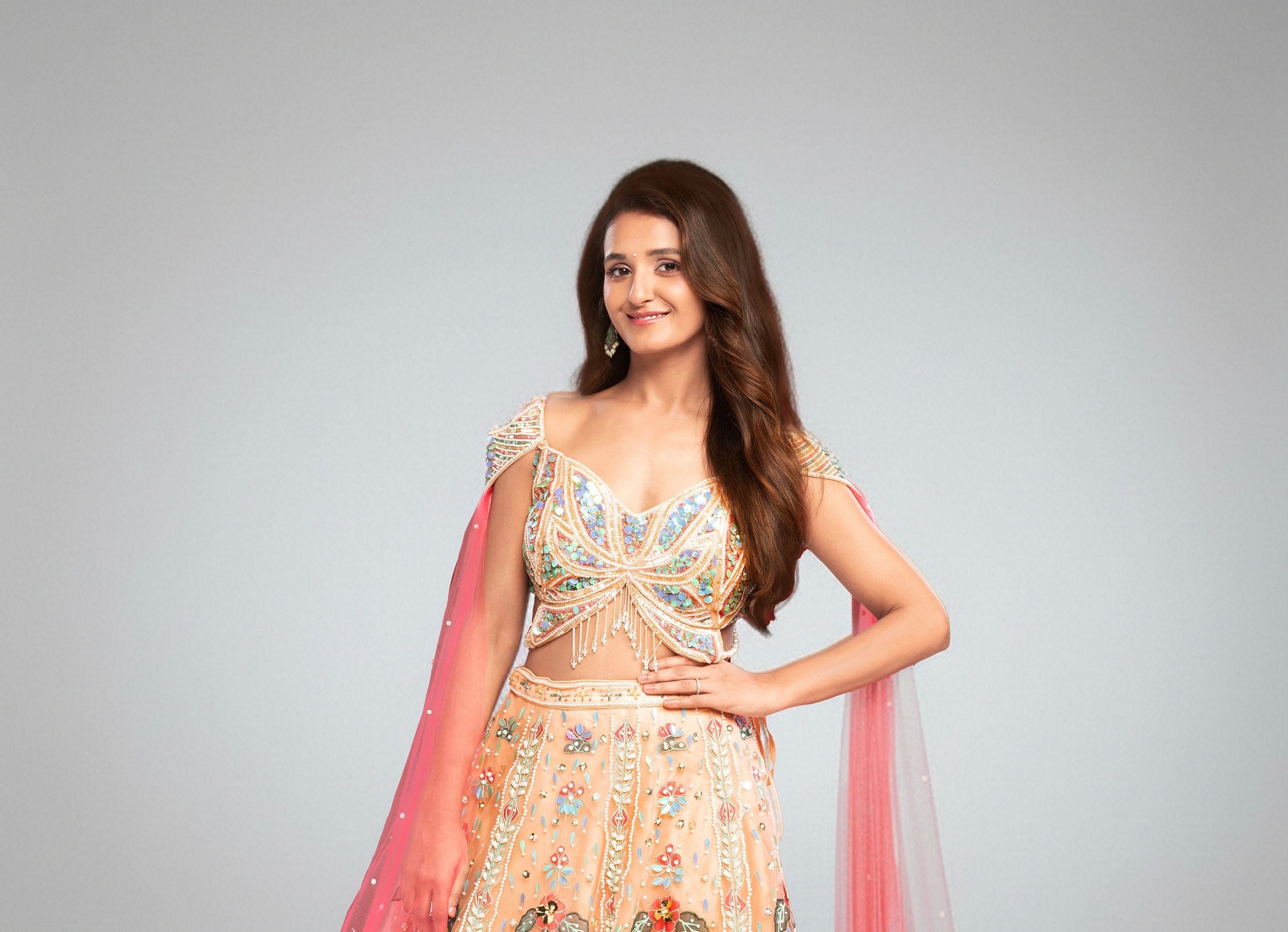 Twamev Women Peach Net Hand Embroidered Off-Shoulder Lehenga