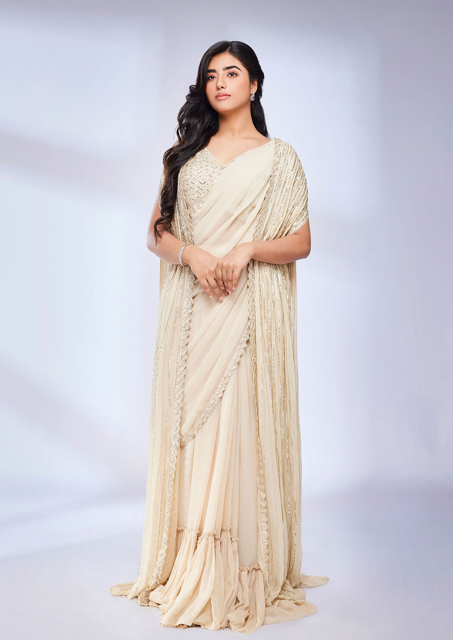 alt message - Twamev Women Dark Cream Scallop Bordered Draped Saree with Cape image number 0