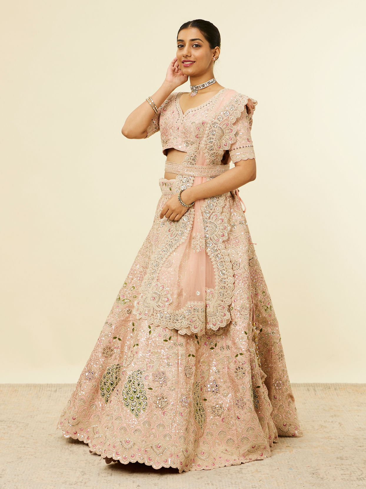 alt message - Mohey Women Golden Pink Sitara Embroidered Lehenga with Peacock Motifs image number 2