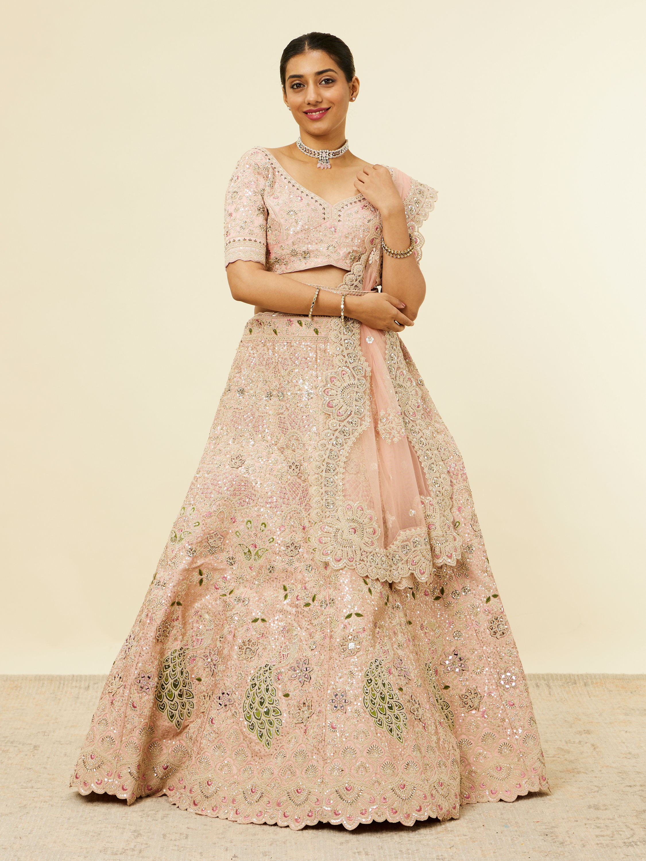 Mohey Women Golden Pink Sitara Embroidered Bridal Lehenga with Peacock Motifs