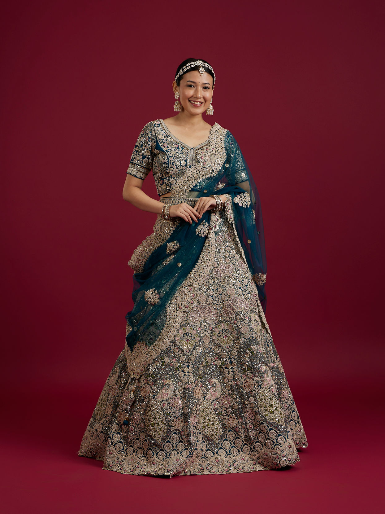 Mohey Women Teal Blue Sequinned Lehenga with Jaal Pattern And Peacock Motifs