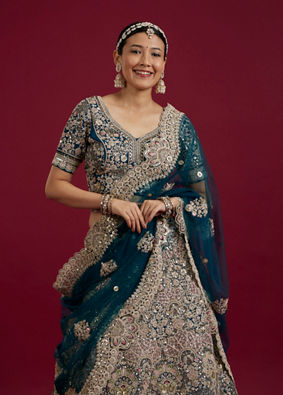 Mohey Women Teal Blue Sequinned Lehenga with Jaal Pattern And Peacock Motifs