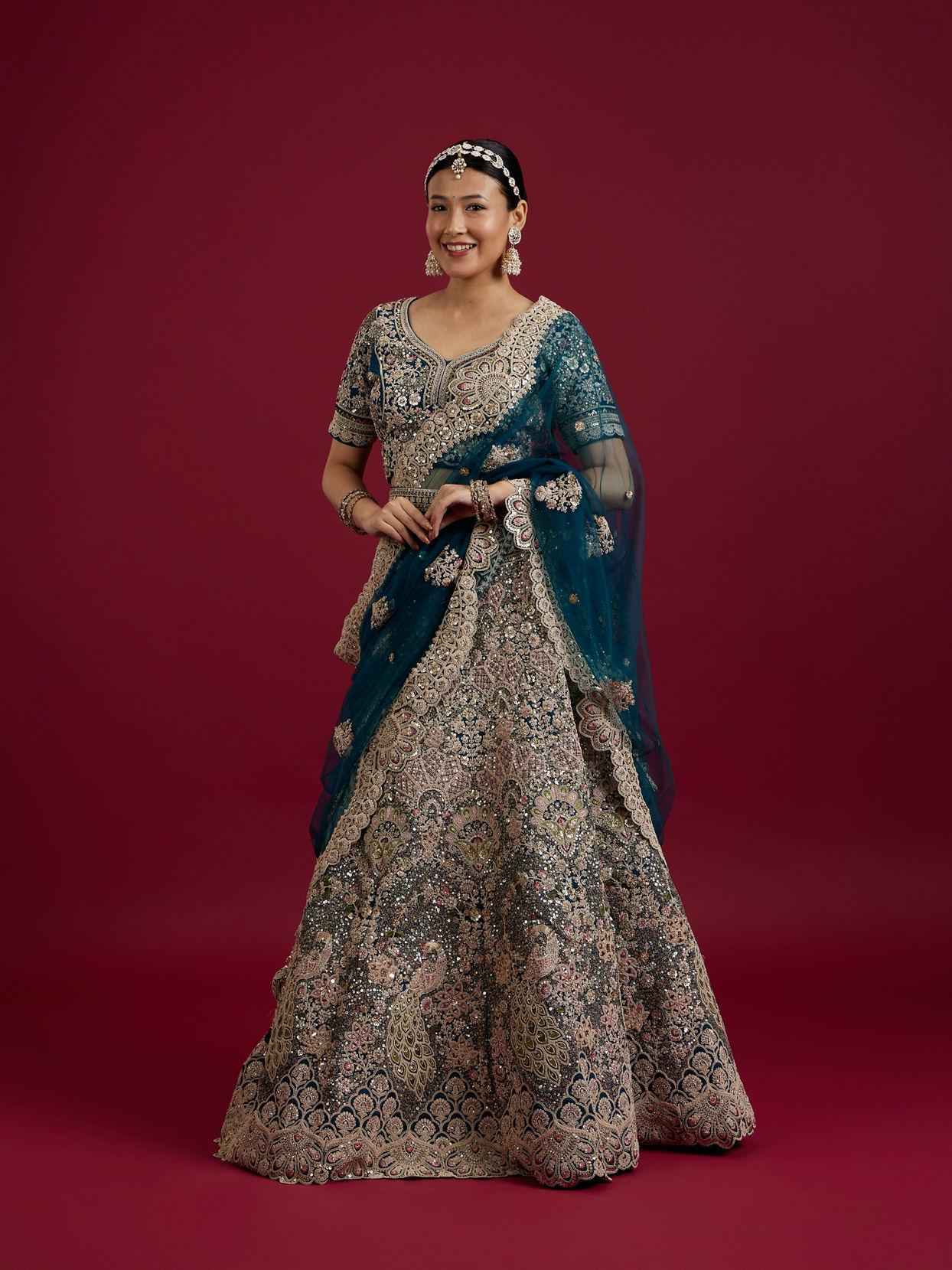 Mohey Women Teal Blue Sequinned Lehenga with Jaal Pattern And Peacock Motifs