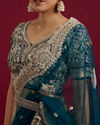Mohey Women Teal Blue Sequinned Lehenga with Jaal Pattern And Peacock Motifs
