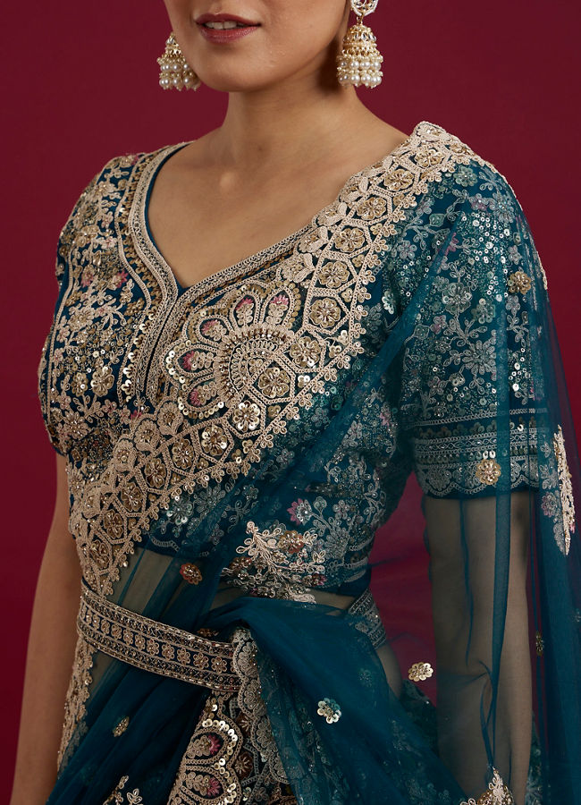 Mohey Women Teal Blue Sequinned Lehenga with Jaal Pattern And Peacock Motifs