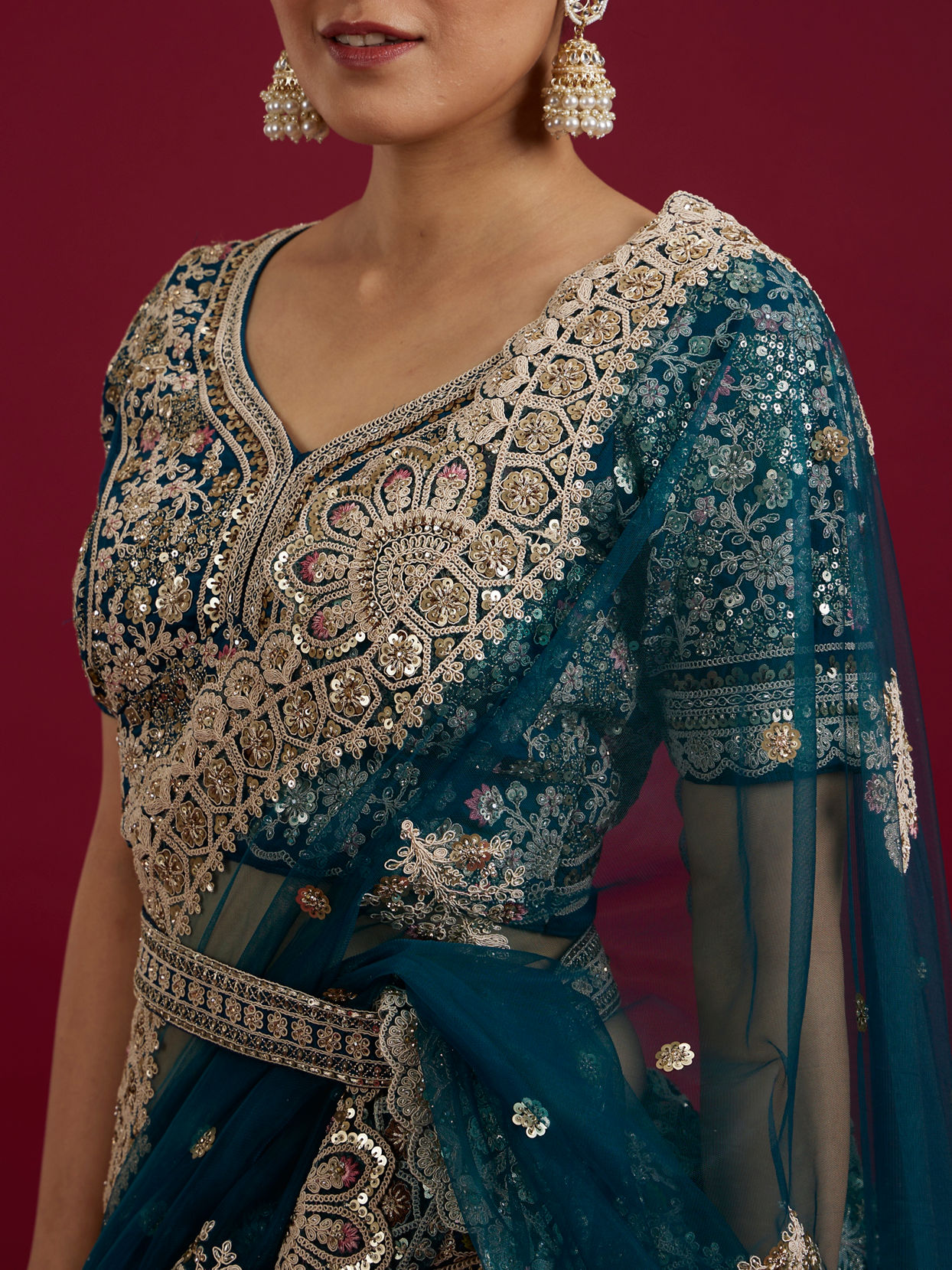 Mohey Women Teal Blue Sequinned Lehenga with Jaal Pattern And Peacock Motifs