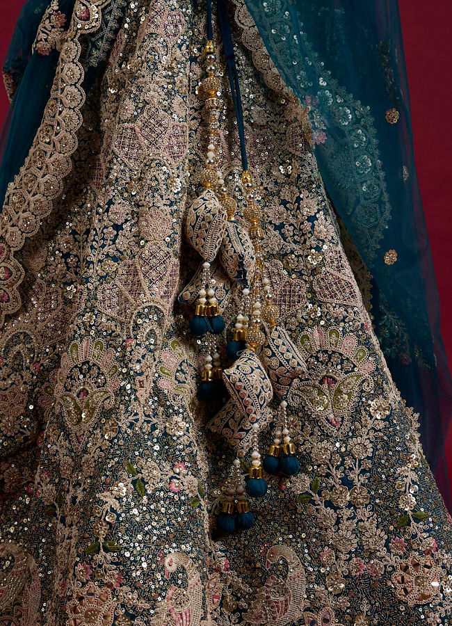 Mohey Women Teal Blue Sequinned Lehenga with Jaal Pattern And Peacock Motifs