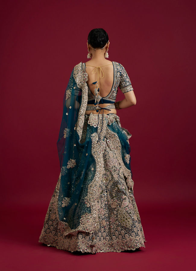 Mohey Women Teal Blue Sequinned Lehenga with Jaal Pattern And Peacock Motifs