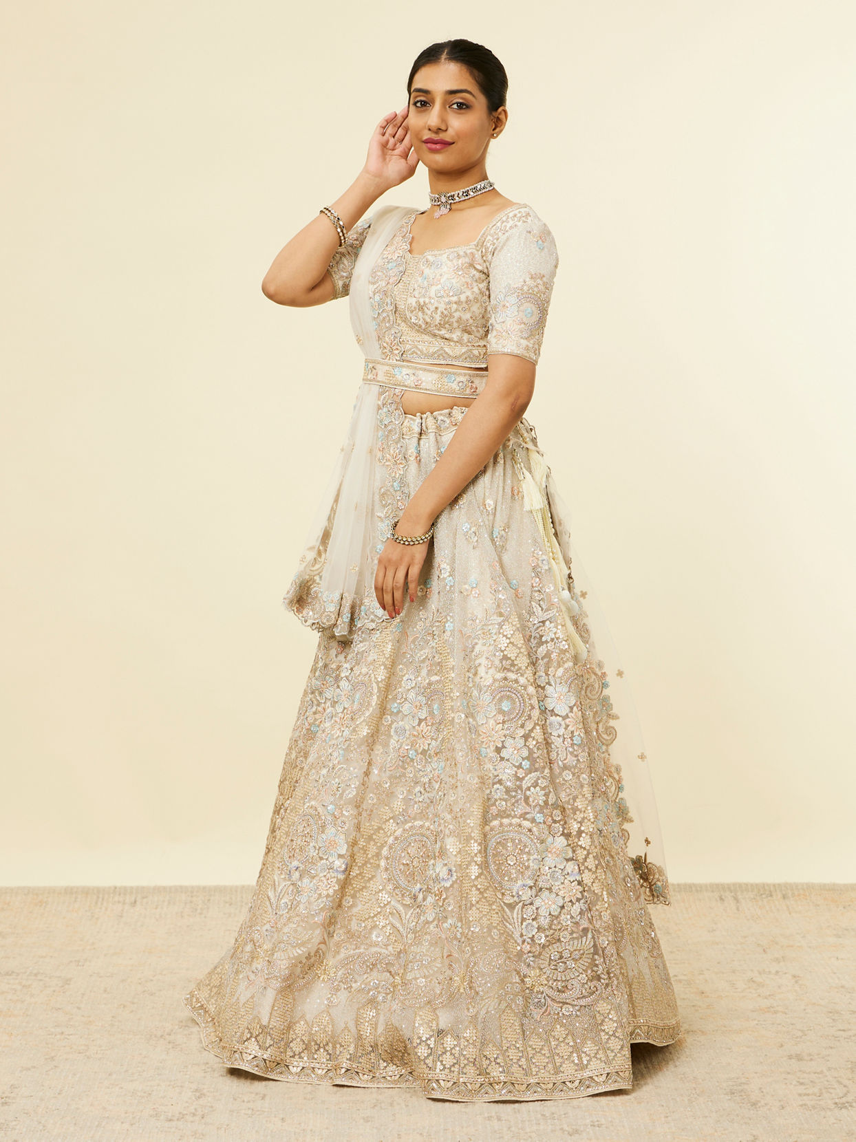 alt message - Mohey Women Dark Cream Bel Buti Patterned Lehenga image number 2