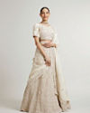 Mohey Women Cream White Paisley & Bel Buti Patterned Bridal Lehenga with Sequin Work & Scalloped Hem image number 0