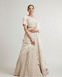 Mohey Women Cream White Paisley Lehenga with Sequin Work And Scalloped Hem