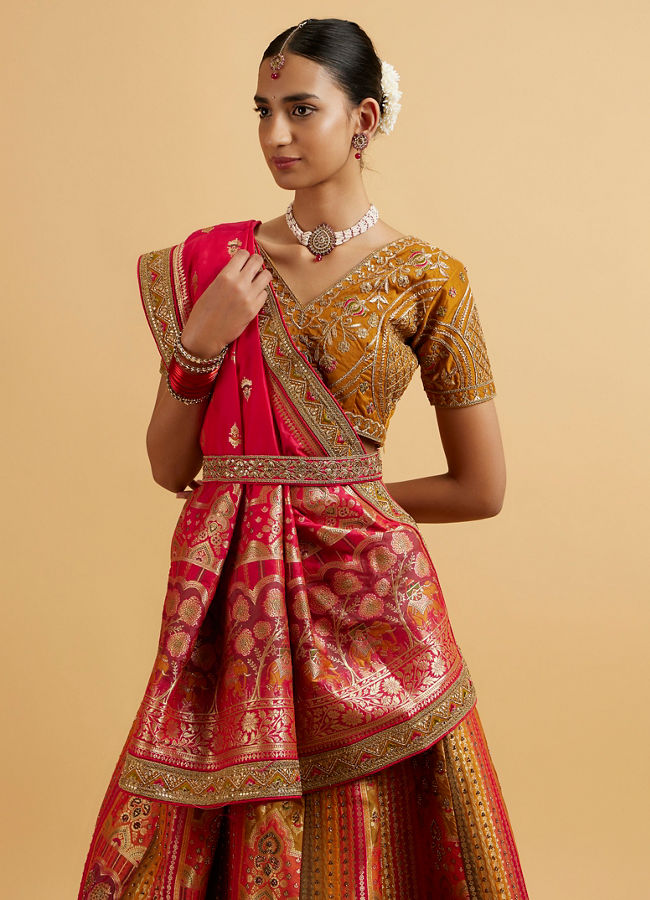 alt message - Mohey Women Orange and Pink Aari Embroidered Benarasi Lehenga image number 1