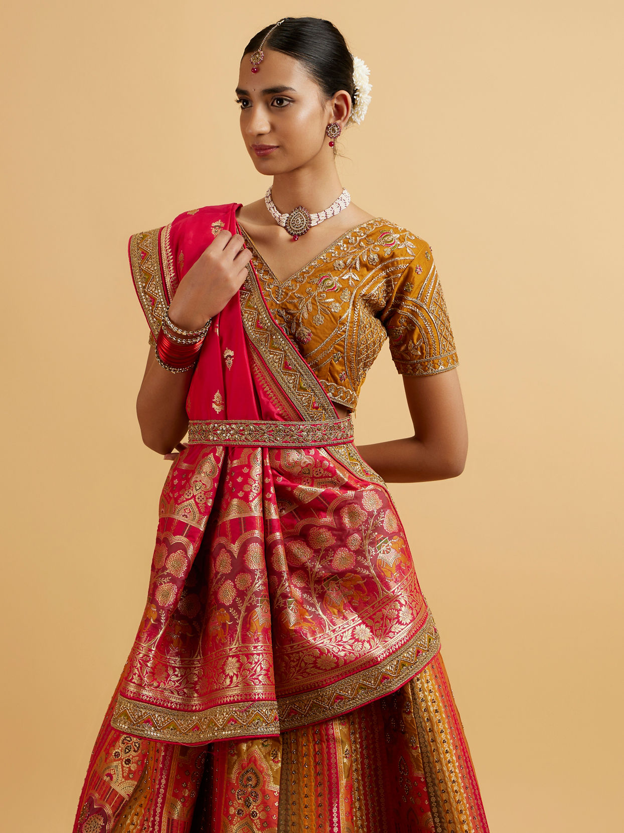 alt message - Mohey Women Orange and Pink Aari Embroidered Benarasi Lehenga image number 1