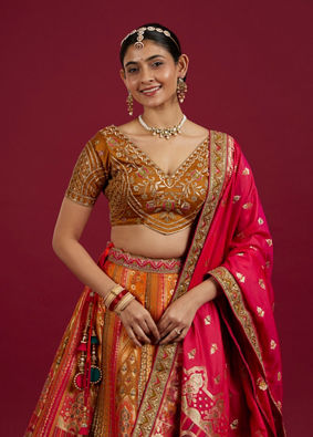 Mohey Women Orange and Pink Aari Embroidered Benarasi Lehenga