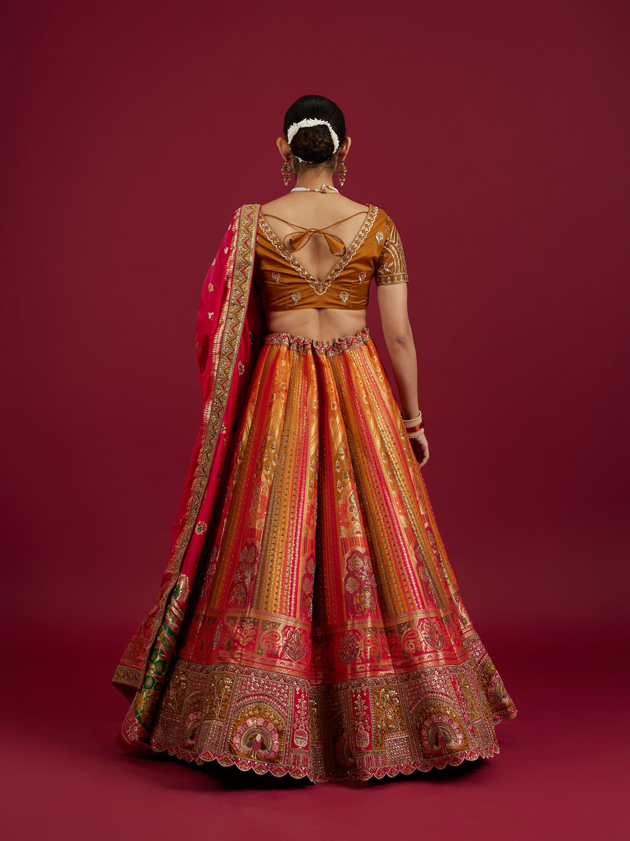 Mohey Women Orange and Pink Aari Embroidered Benarasi Lehenga