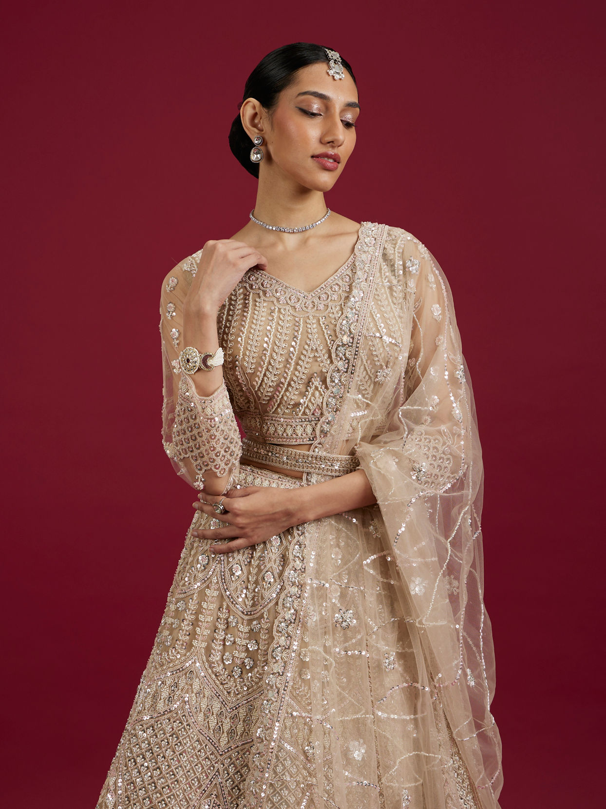 Mohey Women Soft Cream Rhinestone Embellished Lehenga with Teardrop, Fern And Jaal Patterns