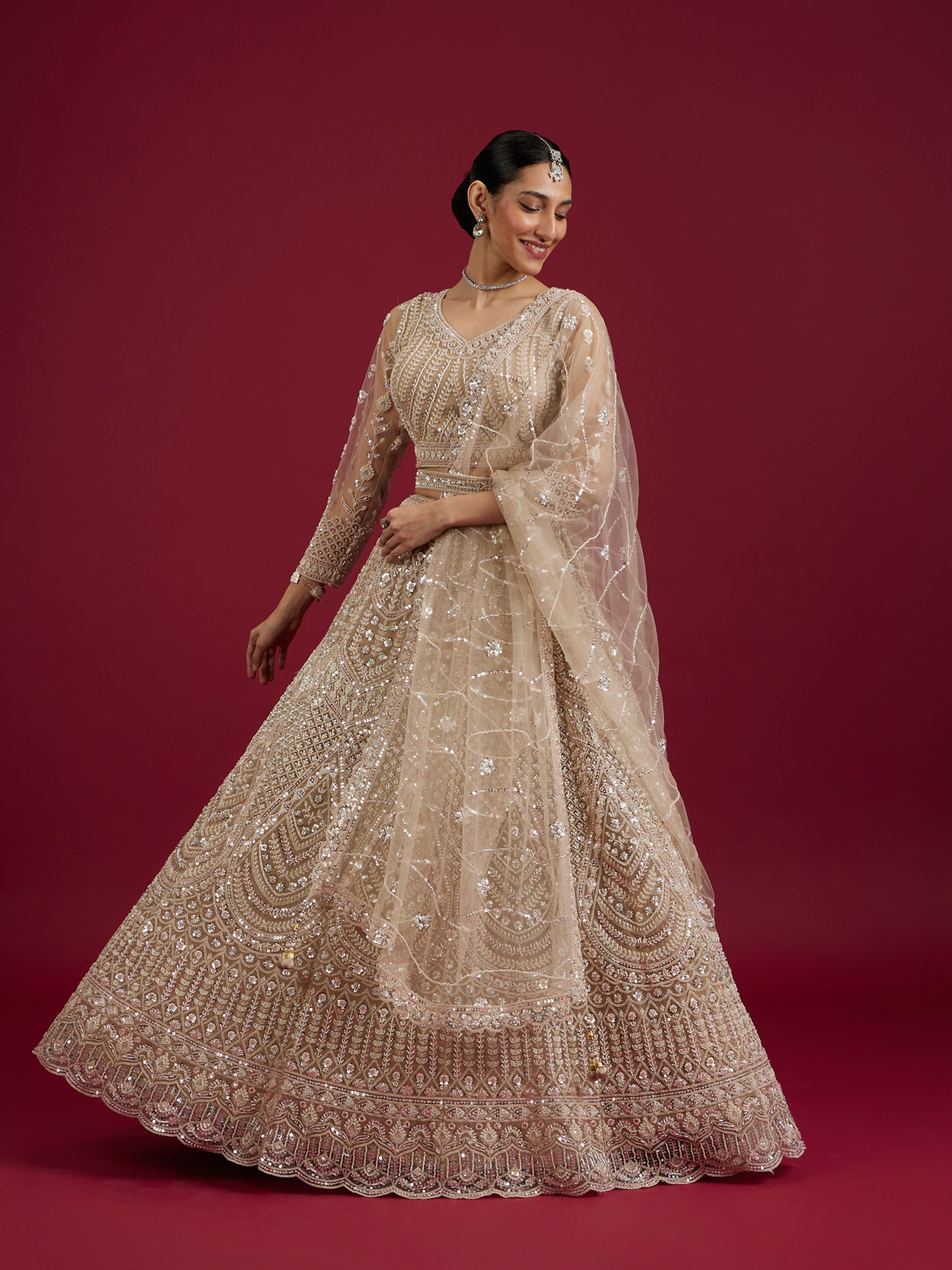 Mohey Women Soft Cream Rhinestone Embellished Lehenga with Teardrop, Fern And Jaal Patterns