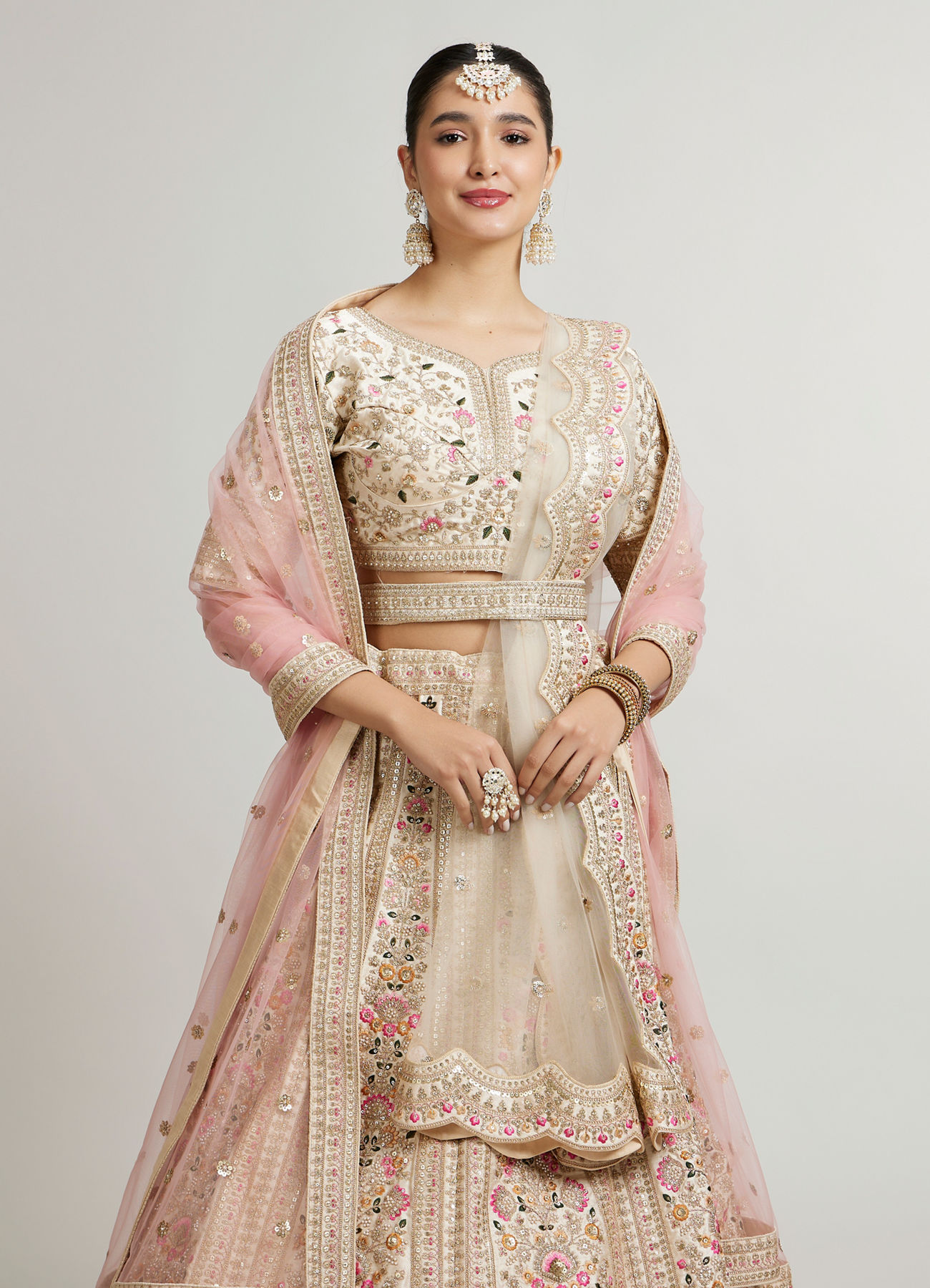 Mohey Women Soft Cream Floral Embroidered Lehenga with Sequin Work and Pillow Trim Latkans