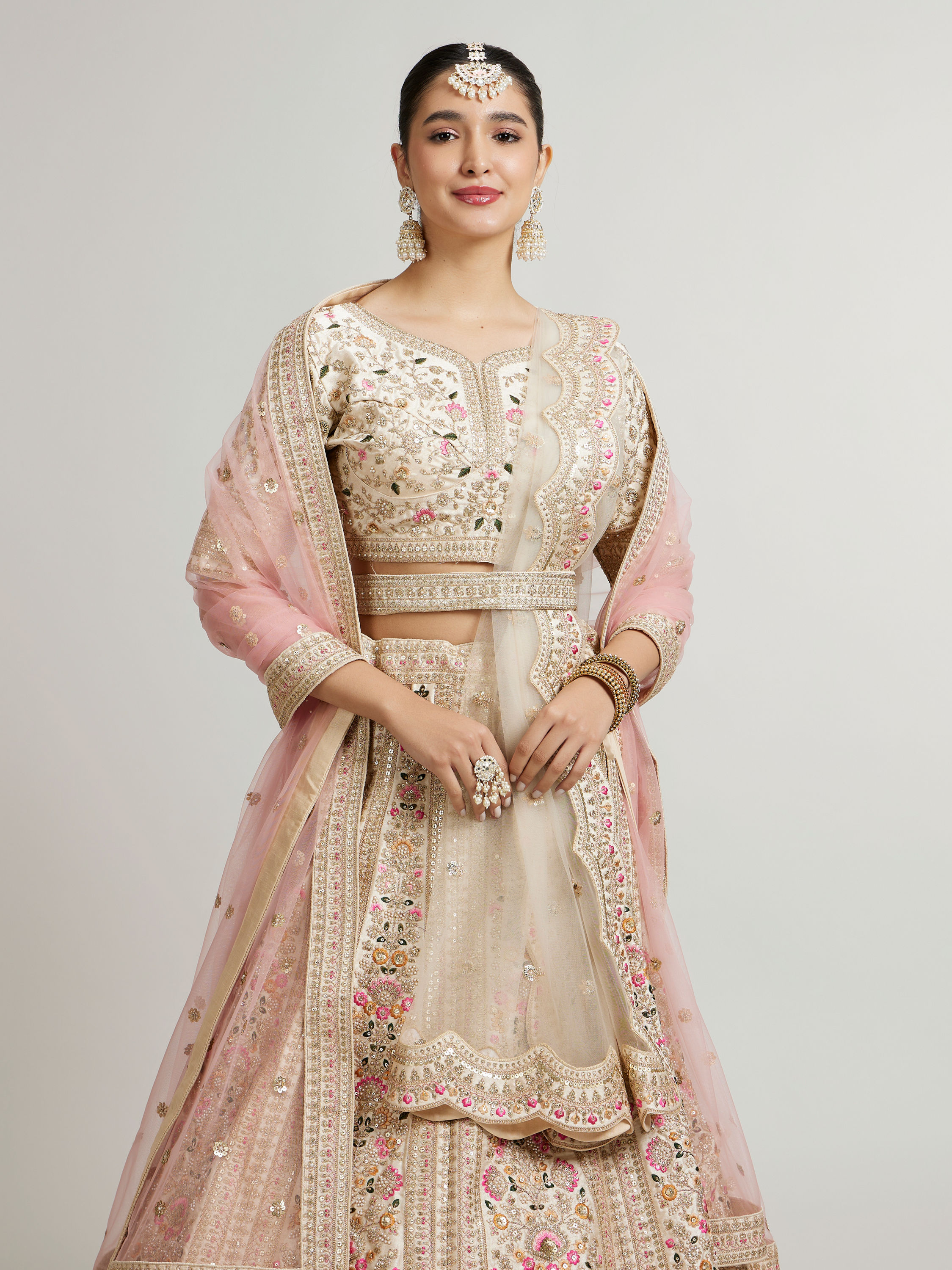 Mohey Women Soft Cream Floral Embroidered Lehenga with Sequin Work and Pillow Trim Latkans