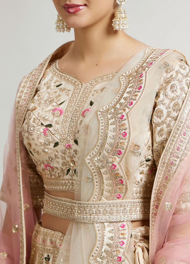 Mohey Women Soft Cream Floral Embroidered Lehenga with Sequin Work And Pillow Trim Latkans