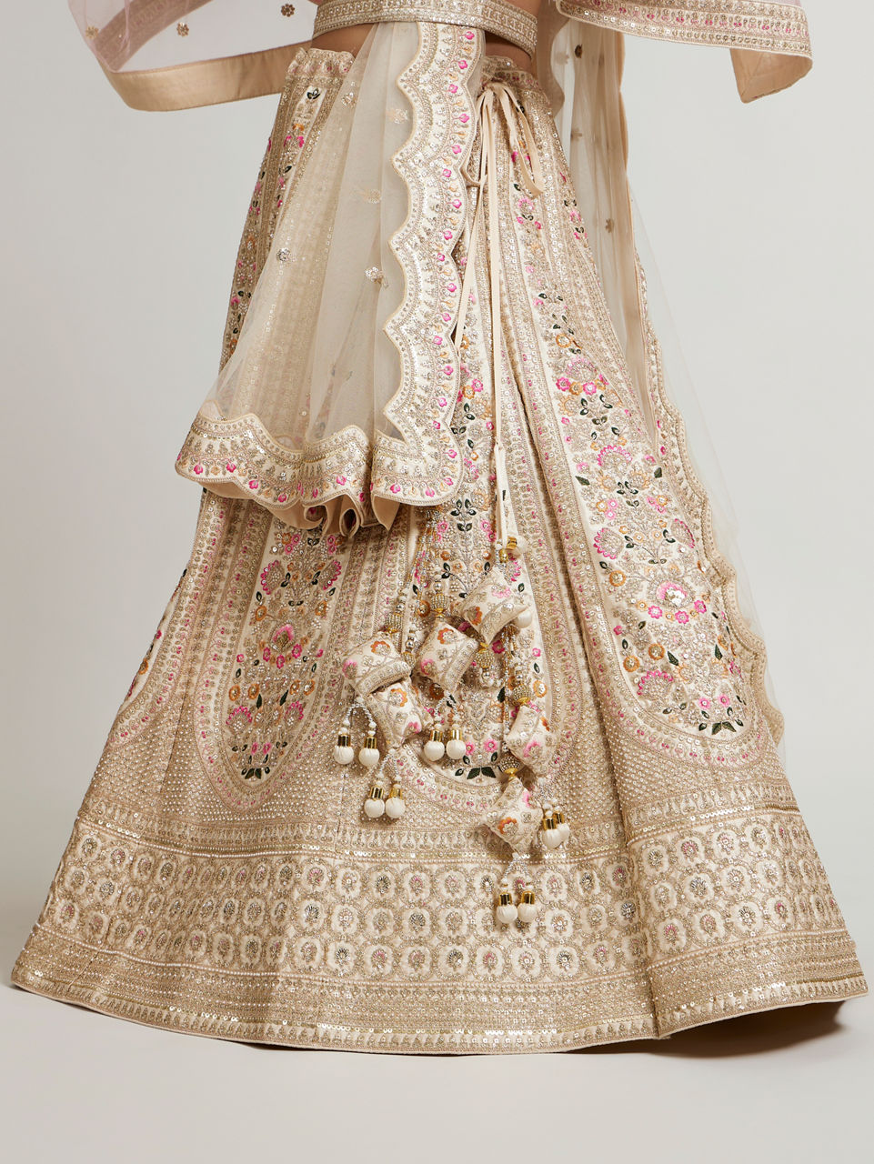 Mohey Women Soft Cream Floral Embroidered Lehenga with Sequin Work And Pillow Trim Latkans