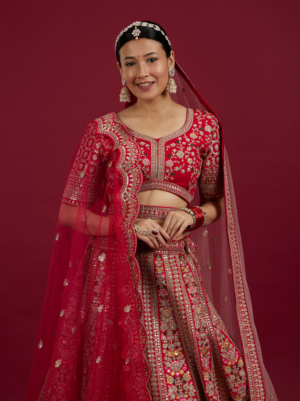 Mohey Women Rani Pink Floral Embroidered Lehenga with Sequin Work And Pillow Trim Latkans