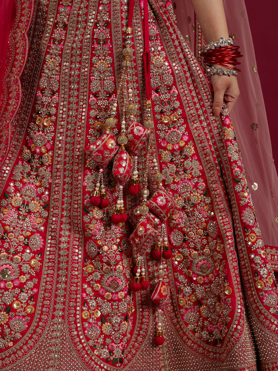 Mohey Women Rani Pink Floral Embroidered Lehenga with Sequin Work And Pillow Trim Latkans