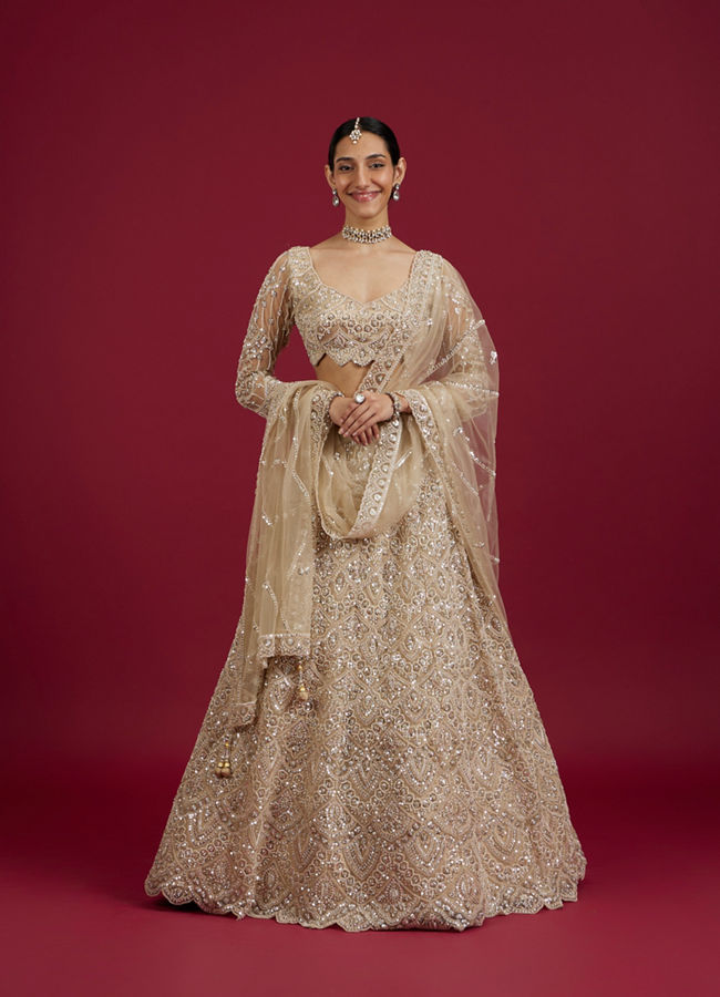 Mohey Women Soft Beige Scallop Patterned Lehenga with Sequin Embroidery And Potli Trim Latkans