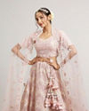 alt message - Mohey Women Blush Pink Floral Embroidered Lehenga with Sequin and Rhinestone Embellishment image number 1