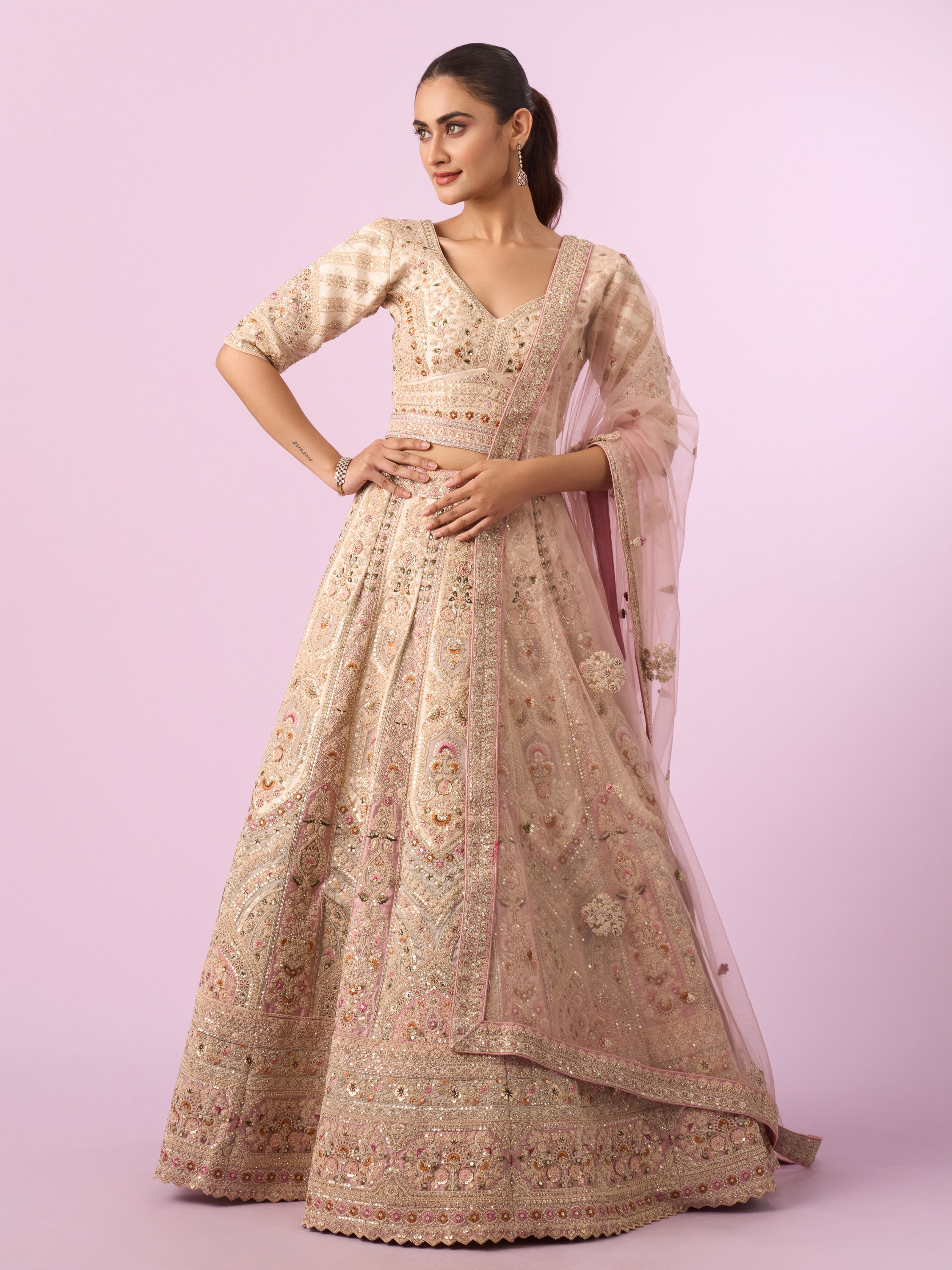 Mohey Women Enthralling Pink Cream Bridal Lehenga