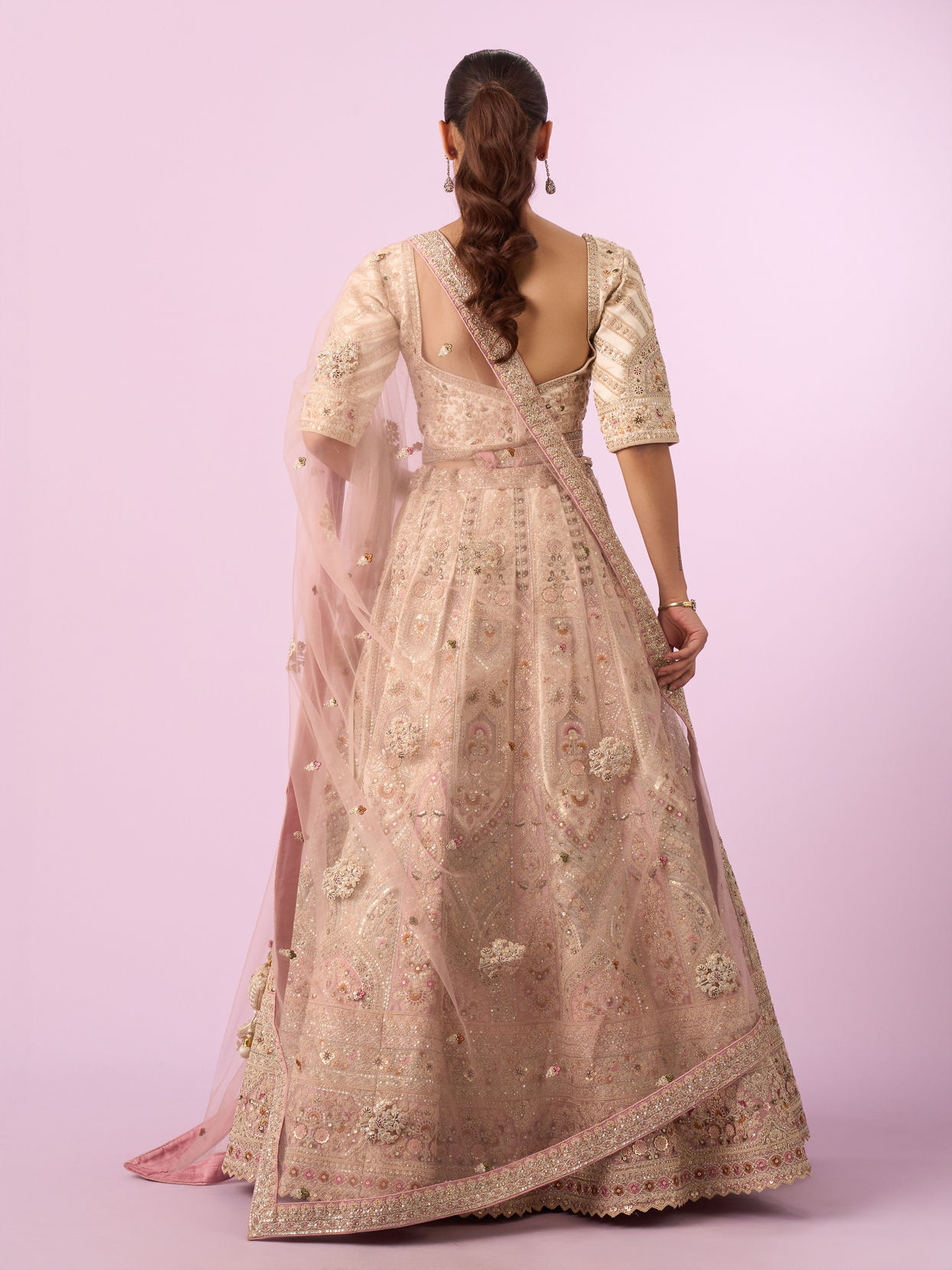 Mohey Women Enthralling Pink Cream Bridal Lehenga