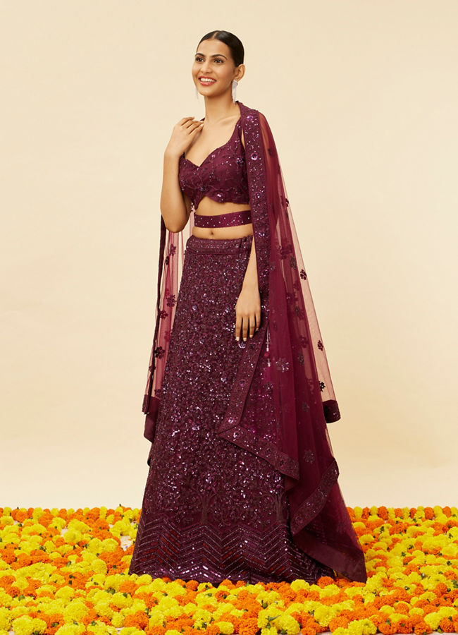 alt message - Mohey Women Wine Bel Buti Embroidered and Sequined Lehenga image number 2