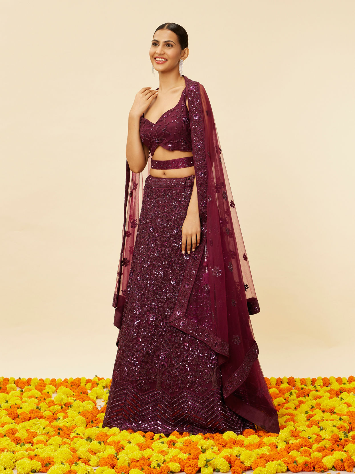 alt message - Mohey Women Wine Bel Buti Embroidered and Sequined Lehenga image number 2