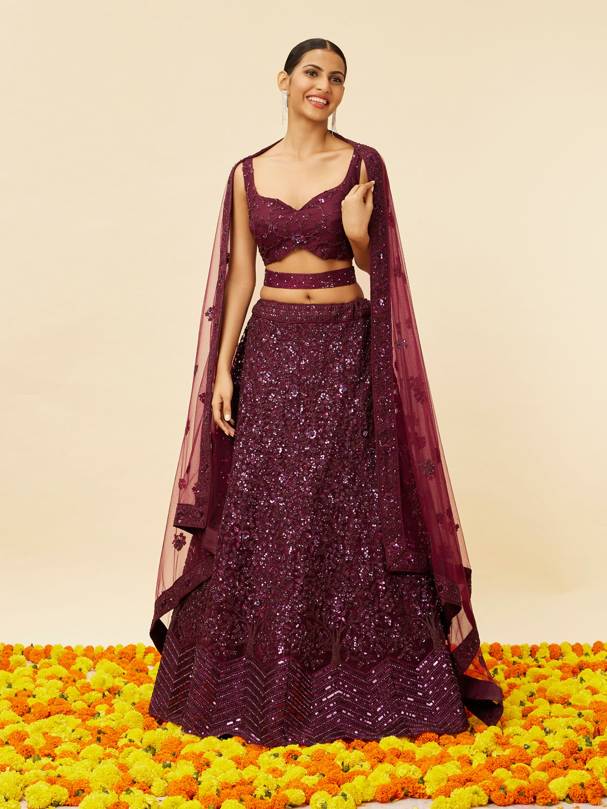 alt message - Mohey Women Wine Bel Buti Embroidered and Sequined Lehenga image number 0