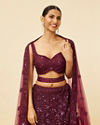 alt message - Mohey Women Wine Bel Buti Embroidered and Sequined Lehenga image number 1