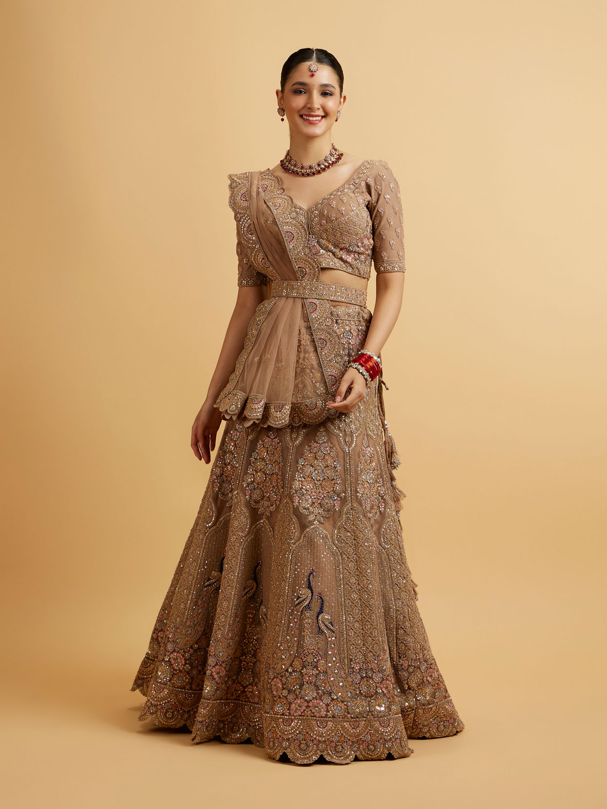 alt message - Mohey Women Golden Fawn Sitara Embroidered Bridal Lehenga image number 0