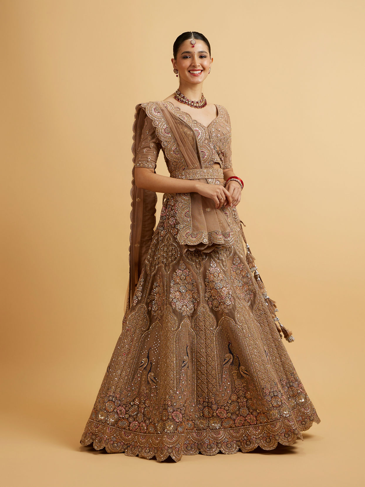 alt message - Mohey Women Golden Fawn Sitara Embroidered Bridal Lehenga image number 2