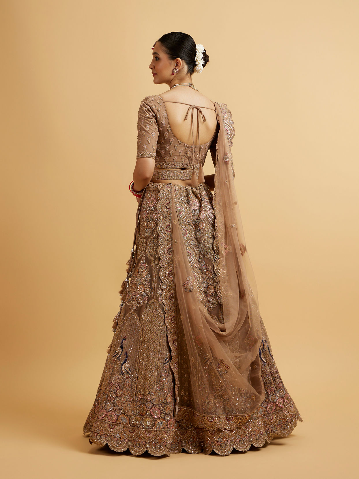 alt message - Mohey Women Golden Fawn Sitara Embroidered Bridal Lehenga image number 4