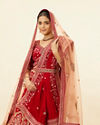 alt message - Mohey Women Intricate Embroidered Red Bridal Lehenga image number 1