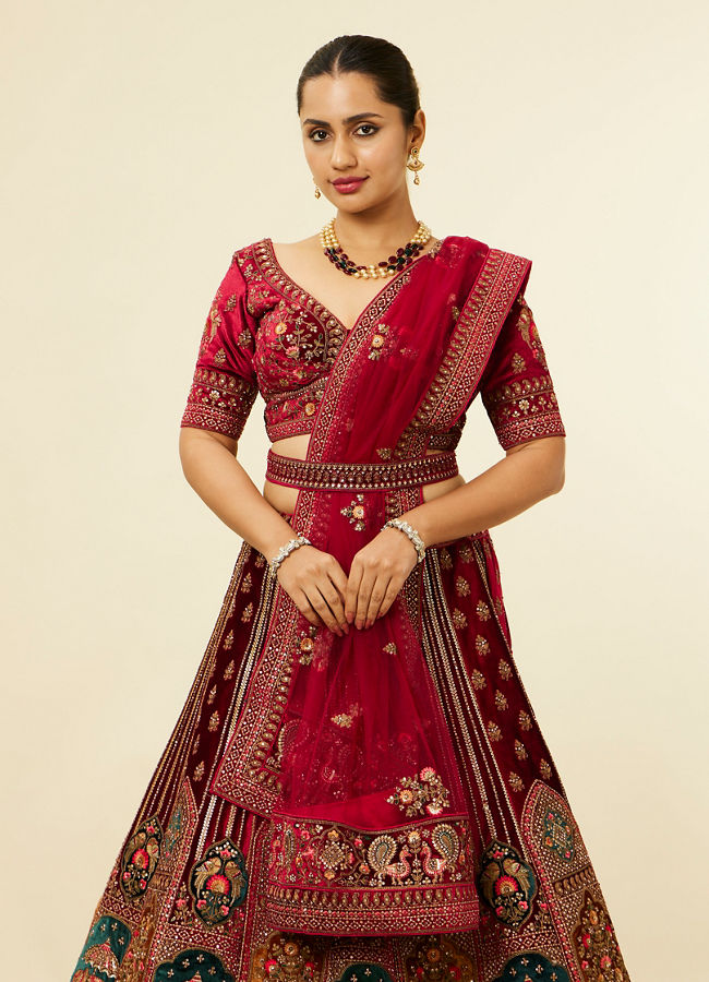 alt message - Mohey Women Maroon Floral Aari Embroidered Lehenga image number 1